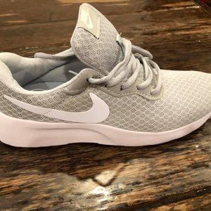 Size  7 Nike  tennis shoes fits more like a 6.5